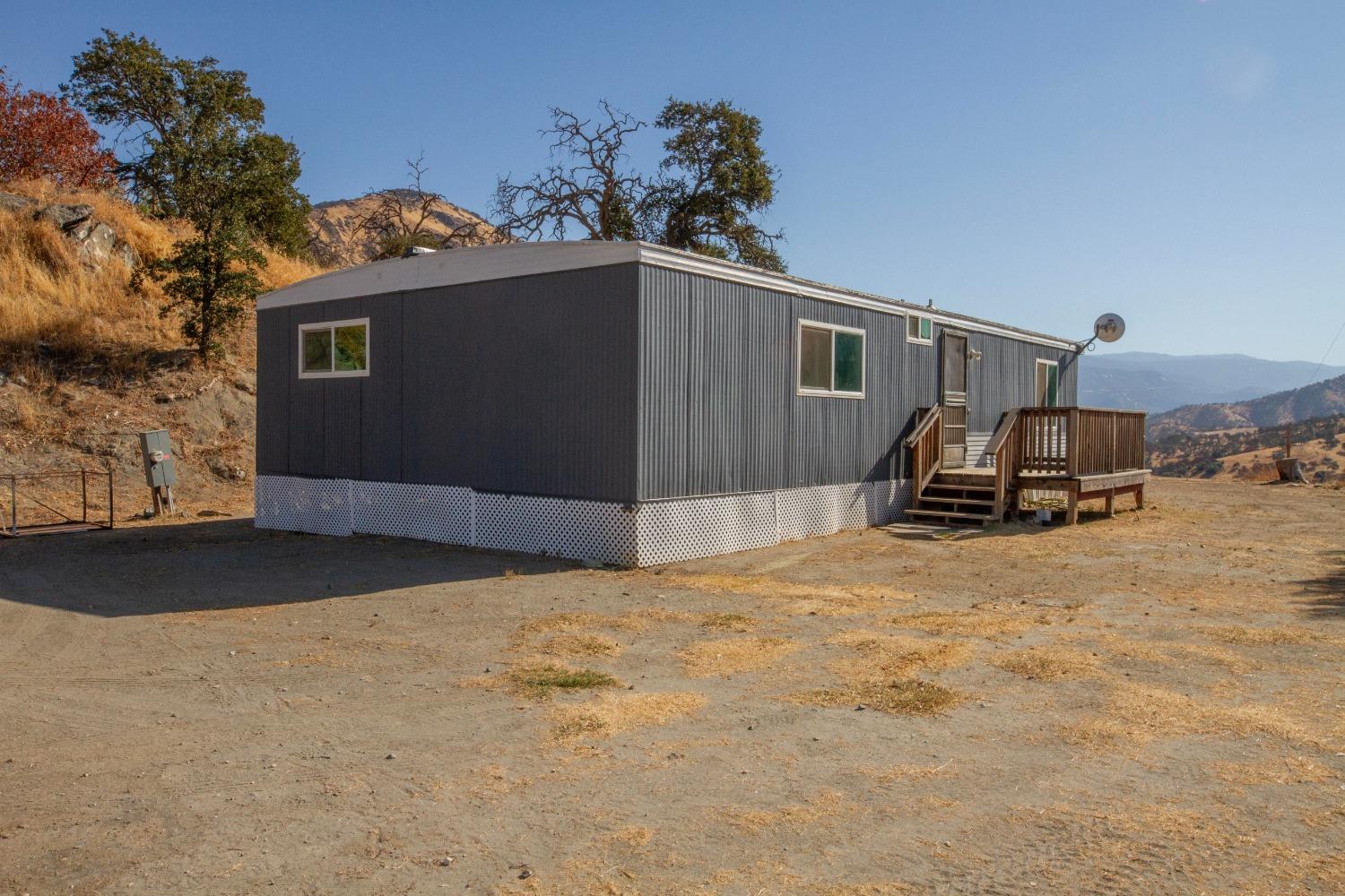 893 Winter Road Squaw Valley, CA 93675 - Photo 23 of 42 a front view of a house with a yard