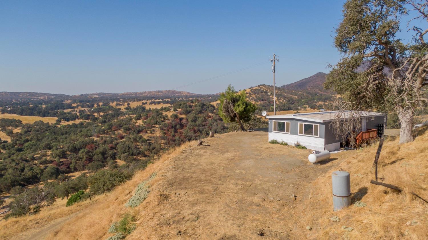 893 Winter Road Squaw Valley, CA 93675 - Photo 25 of 42 a view of a house with a yard