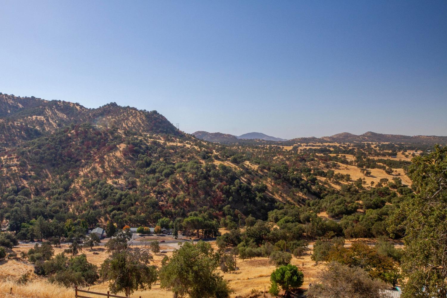 893 Winter Road Squaw Valley, CA 93675 - Photo 41 of 42 a view of a mountain range in a cloudy sky