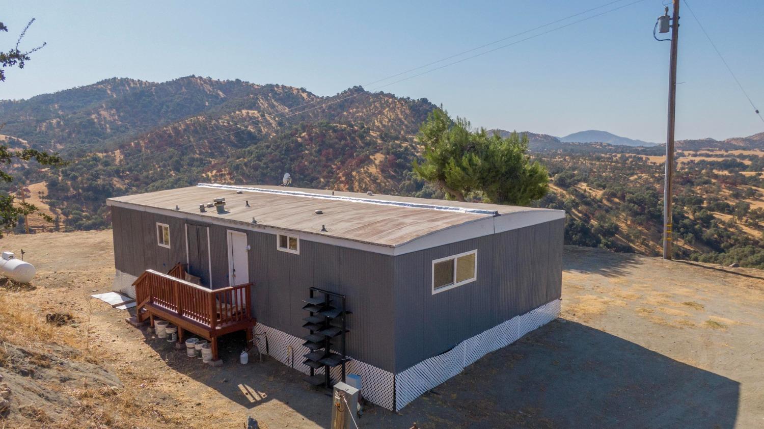893 Winter Road Squaw Valley, CA 93675 - Photo 8 of 42 a view of a house with a yard