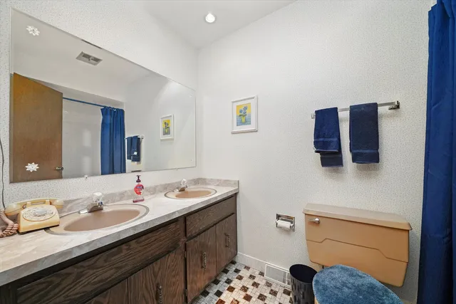 an aerial view of residential houses with outdoor space and street view