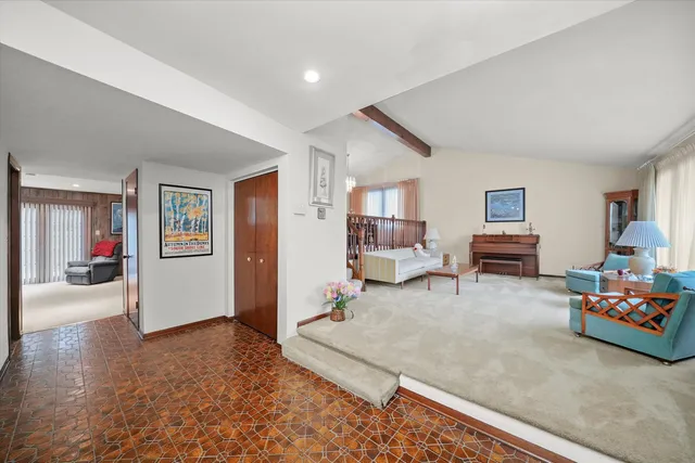 a dining room with furniture window and wooden floor