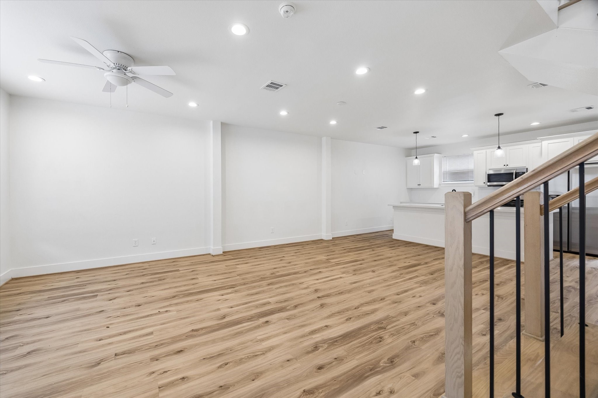2749 Redrock Street, Unit B Houston, TX 77088 - Photo 24 of 24 Upon entrance, the foyer greets you with an open and flowing floor plan to the living space area with the staircase to the right.