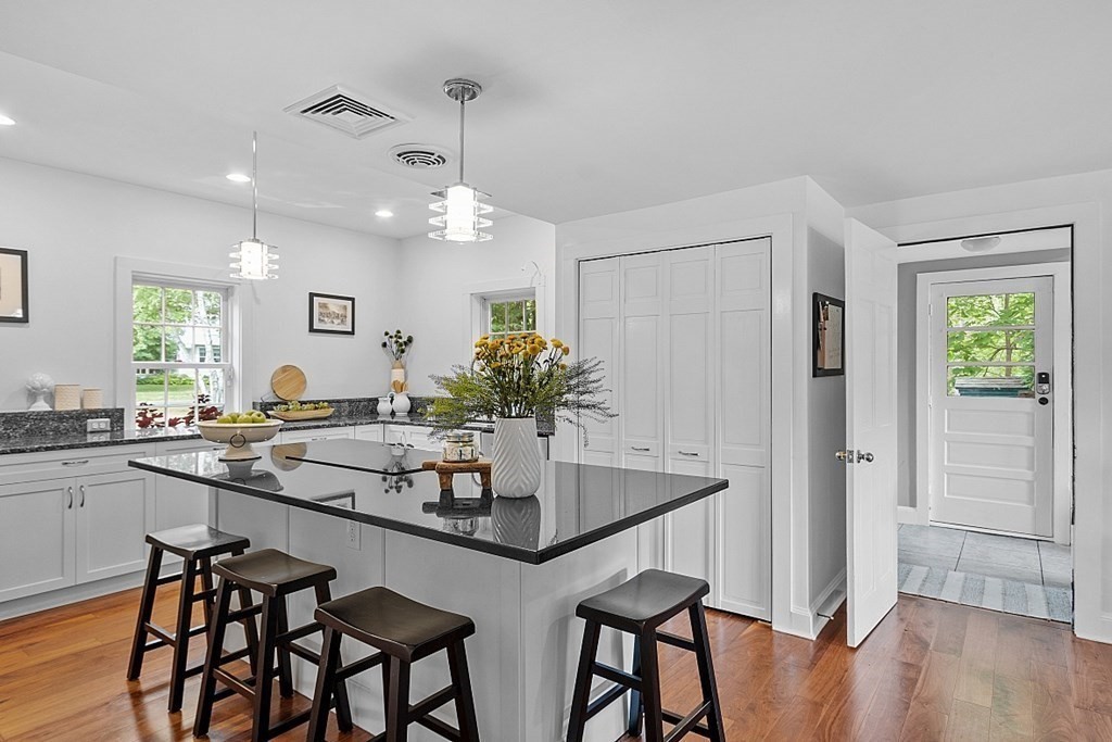 286 Lexington Road Concord, MA 01742 - Photo 18 of 41 a kitchen with a table and chairs in it