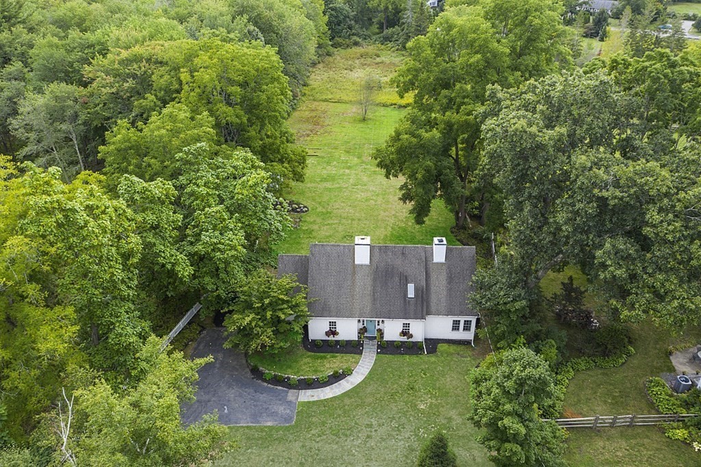 286 Lexington Road Concord, MA 01742 - Photo 2 of 41 an aerial view of a house with yard and trees all around