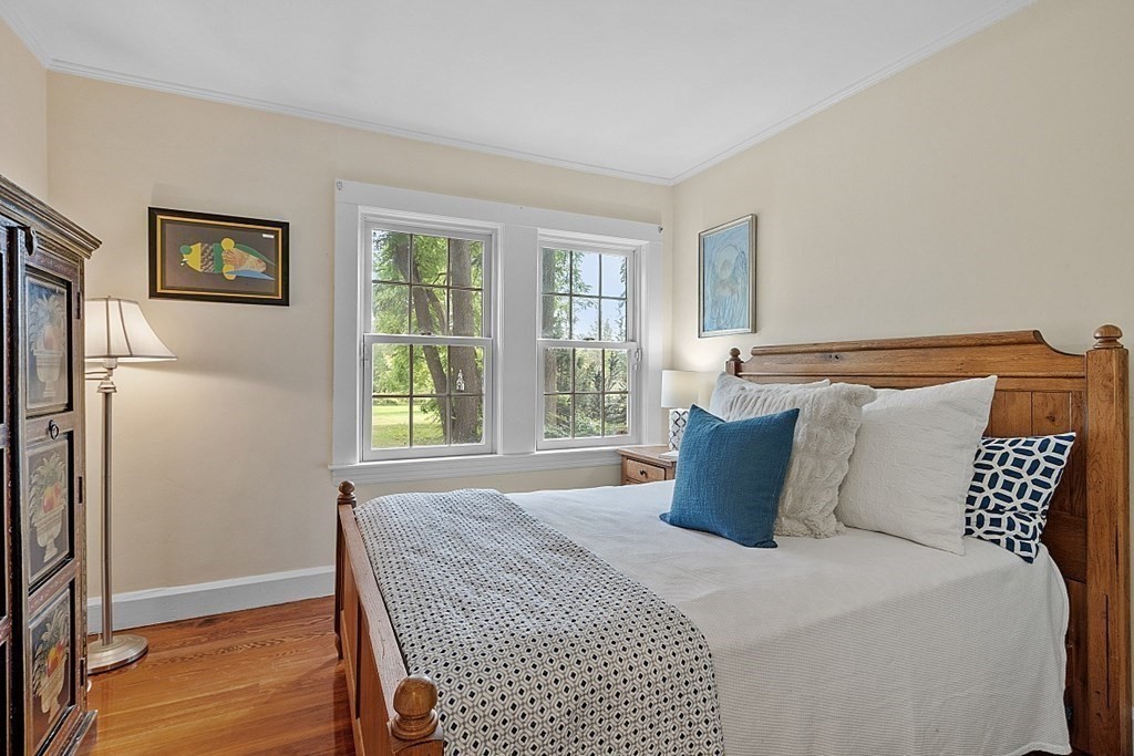 286 Lexington Road Concord, MA 01742 - Photo 24 of 41 a bedroom with a large bed and a window