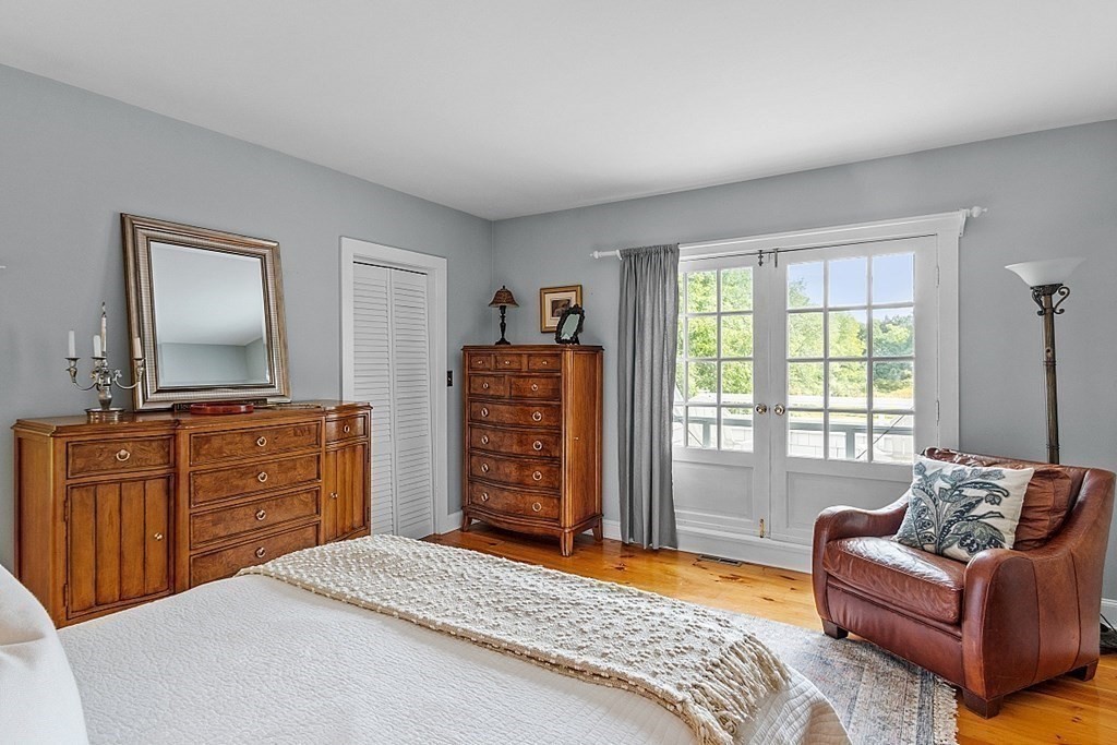 286 Lexington Road Concord, MA 01742 - Photo 28 of 41 a bedroom with a bed and a dresser