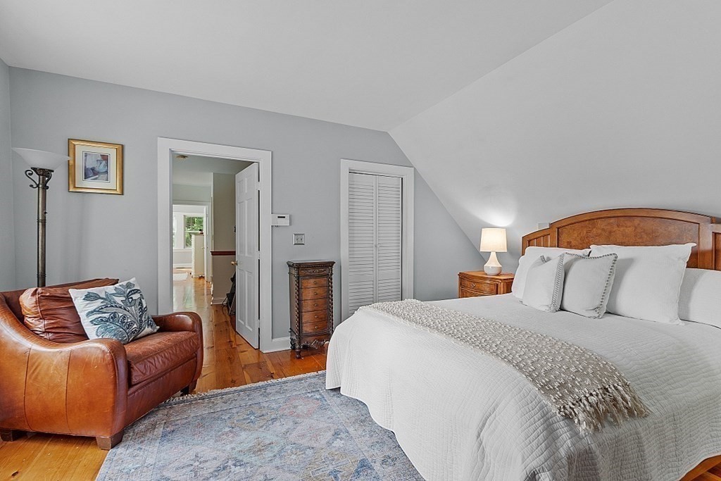 286 Lexington Road Concord, MA 01742 - Photo 29 of 41 a bedroom with a bed and couch