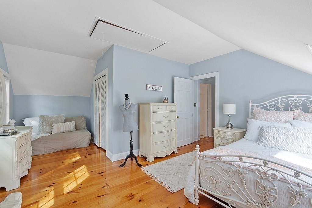 286 Lexington Road Concord, MA 01742 - Photo 32 of 41 a bedroom with a bed and a couch