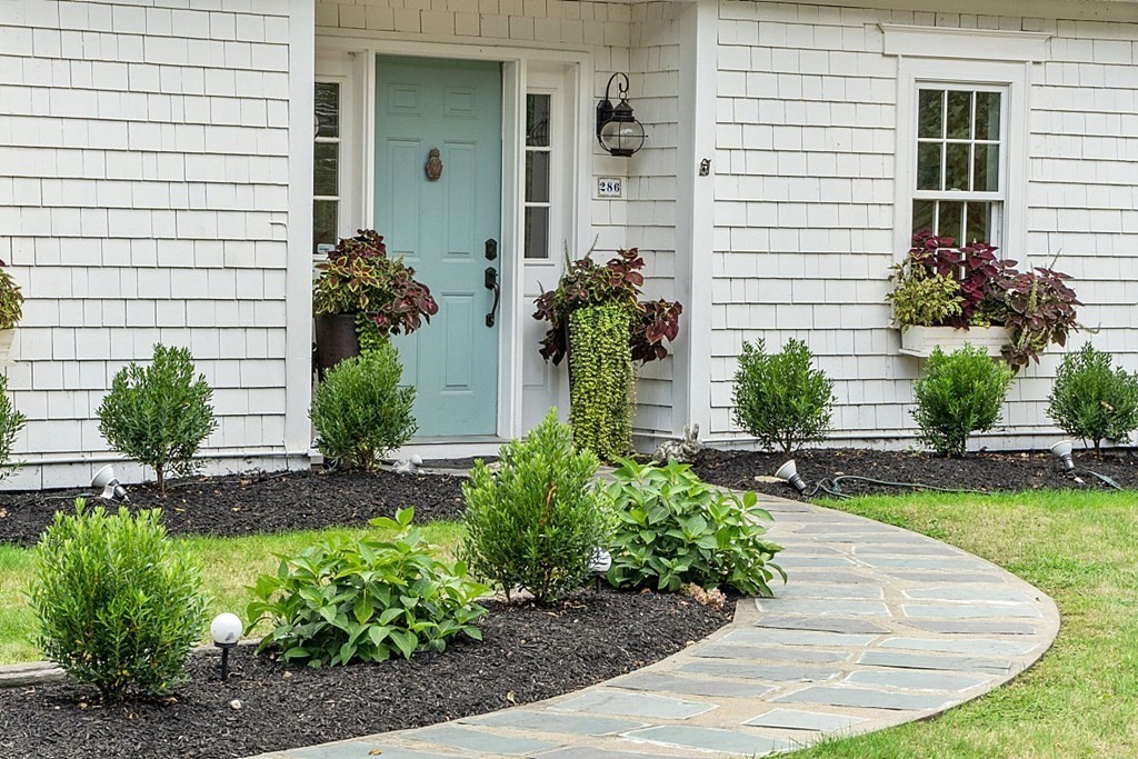 286 Lexington Road Concord, MA 01742 - Photo 4 of 41 a view of a house with potted plants