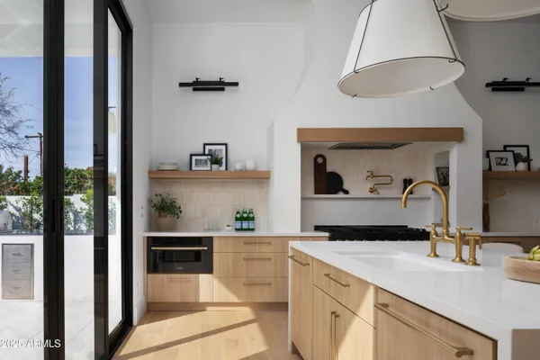 a kitchen with a sink and cabinets
