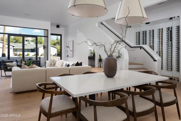 a view of a dining room with furniture window and wooden floor