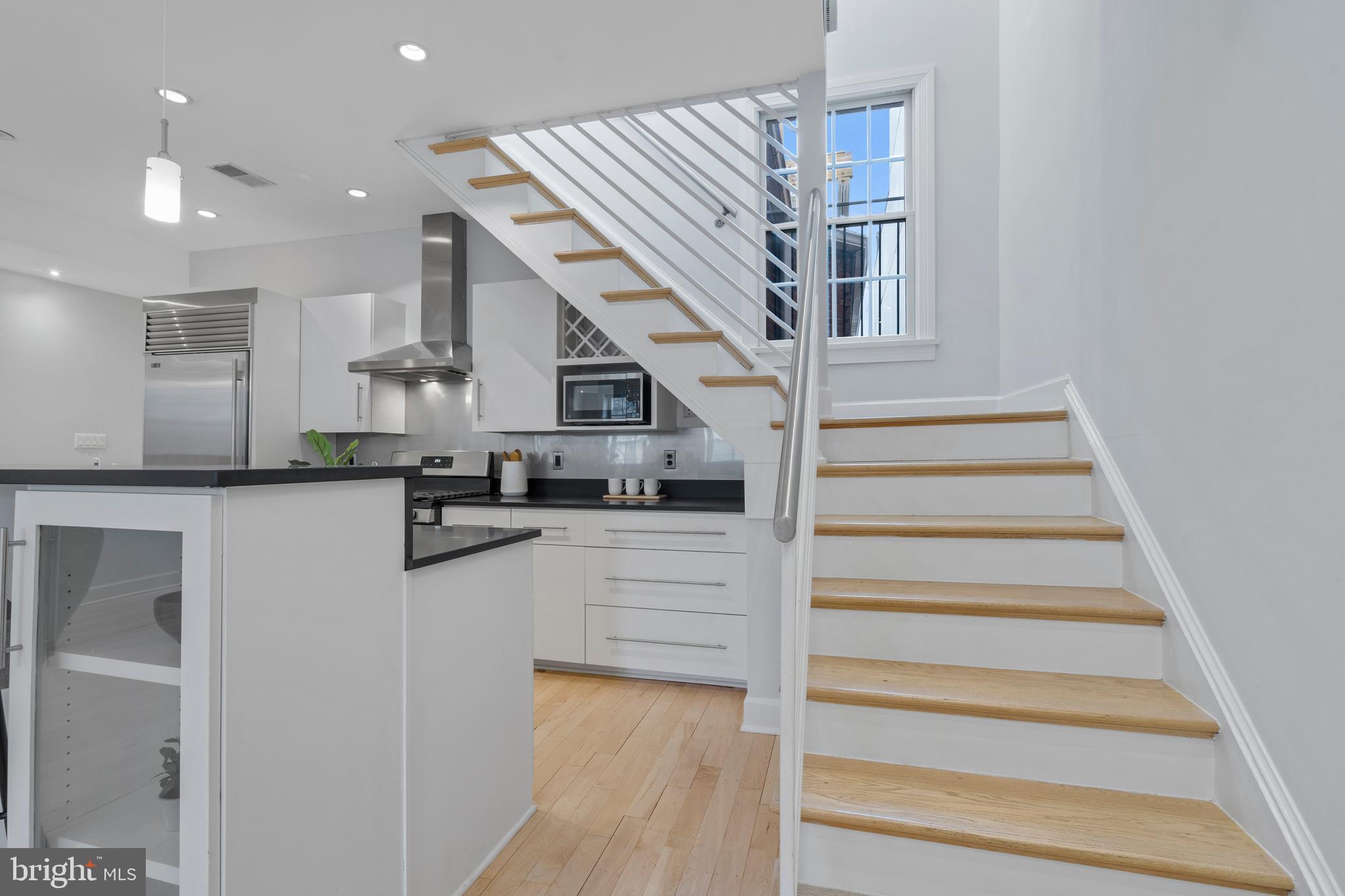 1111 M Street Northwest, Unit 7 Washington, DC 20005 - Photo 16 of 38 Staircase to Upper Level