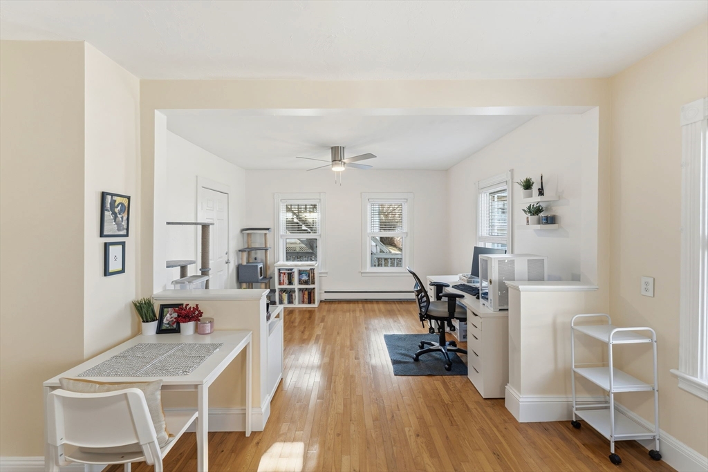 17 Cutler Street, Unit 1 Webster, MA 01570 - Photo 13 of 33 a living room with furniture and a wooden floor