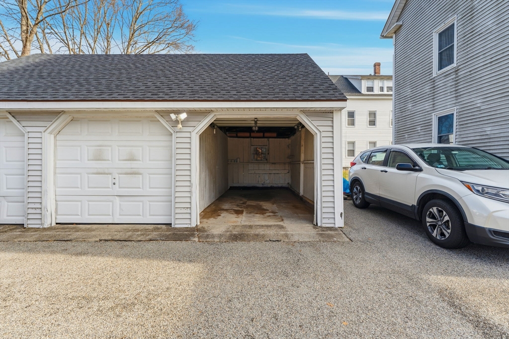 17 Cutler Street, Unit 1 Webster, MA 01570 - Photo 29 of 33 a view of garage and a car parked in garage