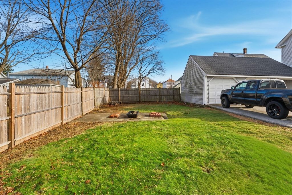 17 Cutler Street, Unit 1 Webster, MA 01570 - Photo 31 of 33 a car parked in front of a house with a yard