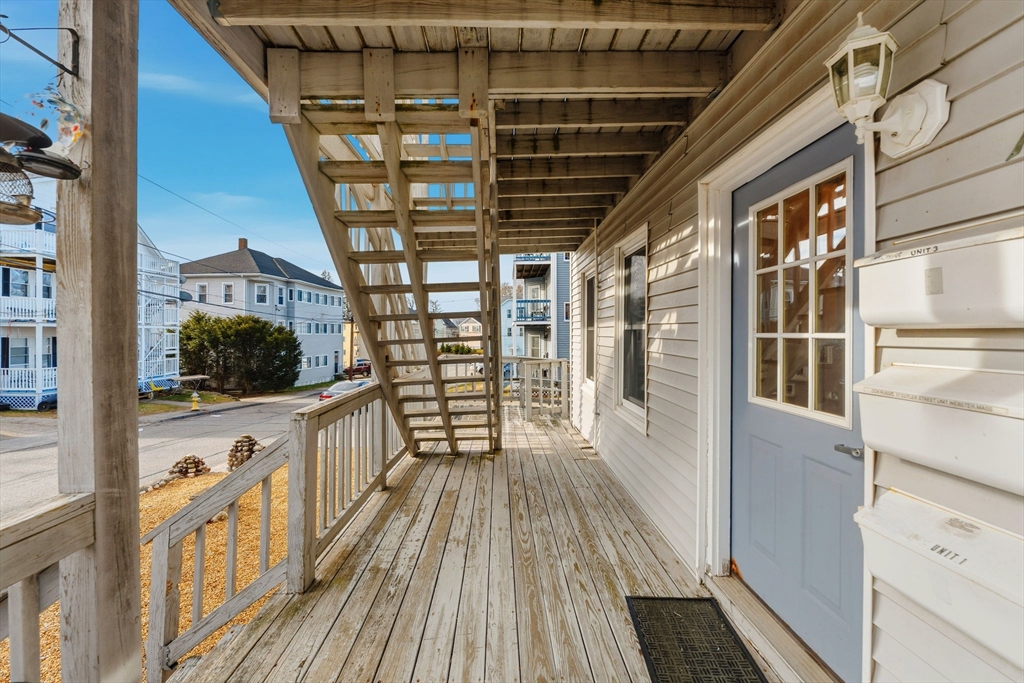 17 Cutler Street, Unit 1 Webster, MA 01570 - Photo 4 of 33 a view of a balcony with wooden floor