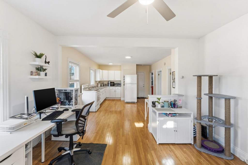 17 Cutler Street, Unit 1 Webster, MA 01570 - Photo 6 of 33 a view of a workspace with furniture and wooden floor
