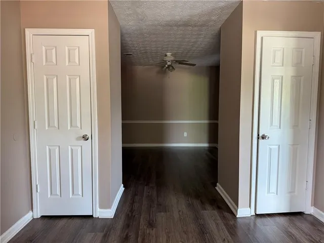 an empty room with wooden floor