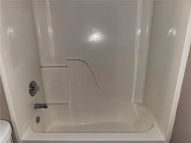 a close view of a bathtub in bathroom