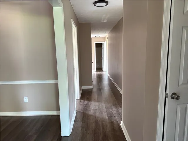 a view of gallery with wooden floor