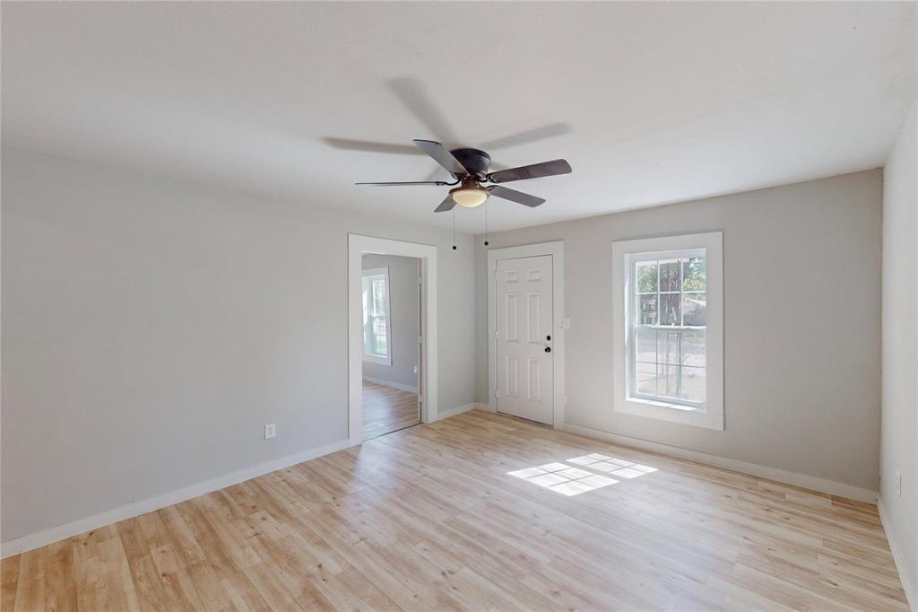 3603 York Street Dallas, TX 75210 - Photo 15 of 16 a view of empty room with wooden floor and fan