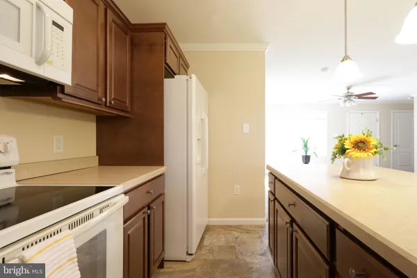 a utility room with cabinets washer and dryer