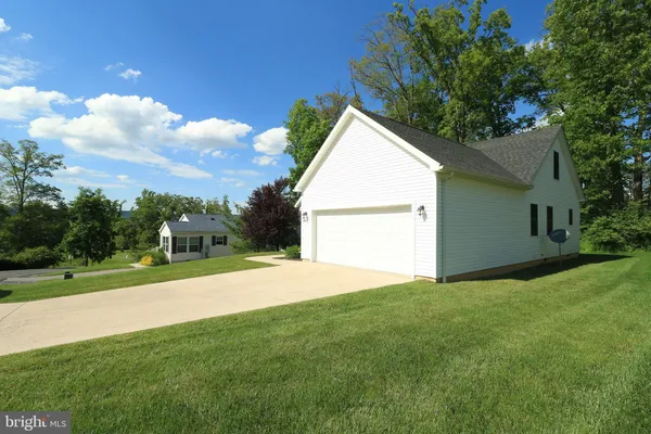 a view of a backyard of the house