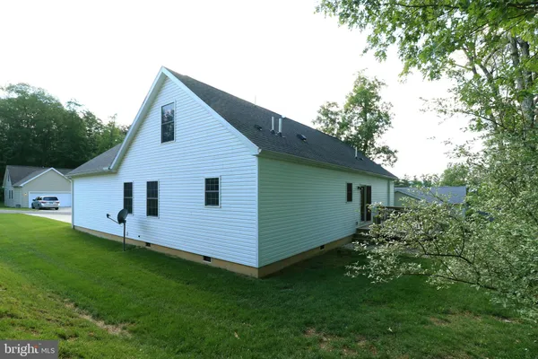 a view of balcony with wooden floor and fence