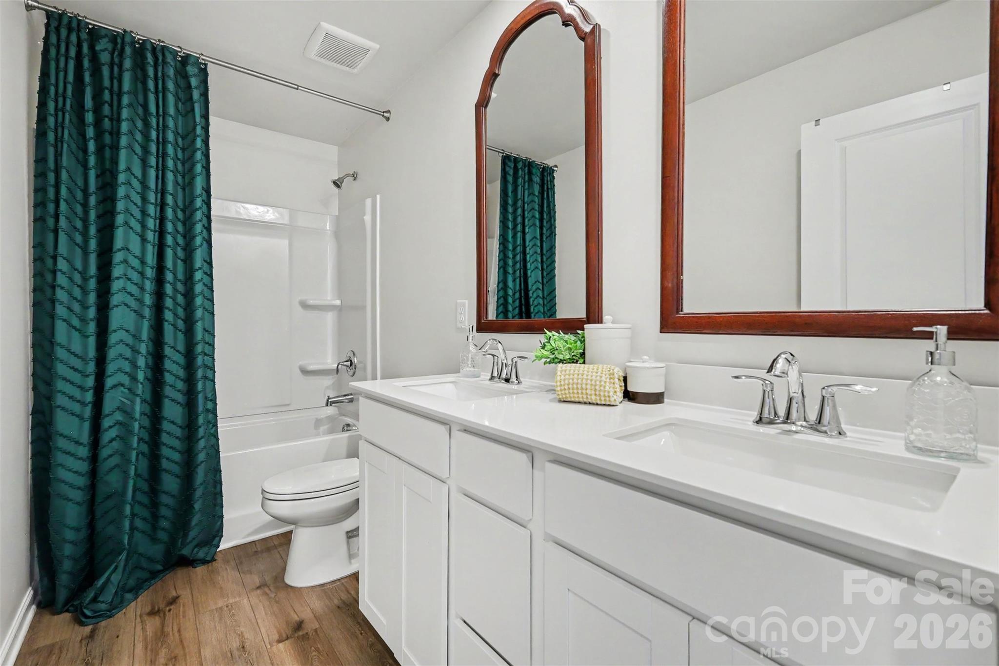 633 Mile Crk Road Edgemoor, SC 29712 - Photo 19 of 26 a bathroom with a double vanity sink toilet and shower