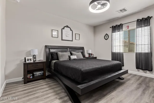 a bedroom with a bed and window