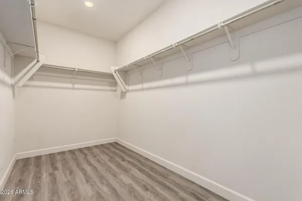 a view of an empty walk in closet