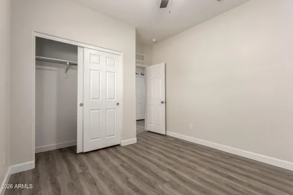 an empty room with wooden floor