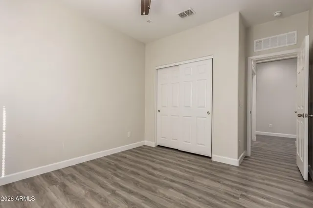 an empty room with wooden floor