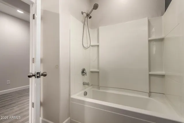 a bathroom with a shower and a shower