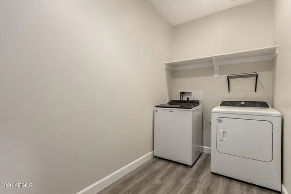 a view of a storage & utility room with washer and dryer