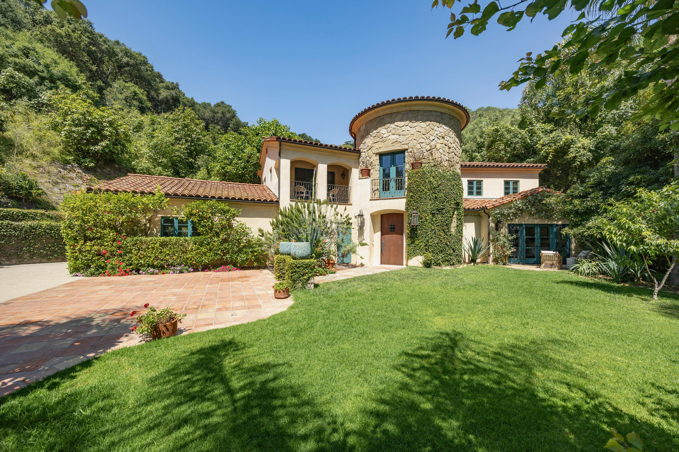 1493 Sycamore Canyon Road Montecito, CA 93108 - Photo 3 of 47 a front view of a house with garden