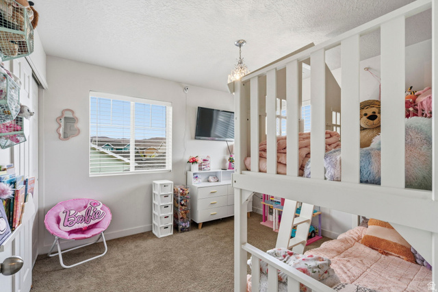 7685 Timber Country Road Eagle Mountain, UT 84005 - Photo 21 of 39 Light-filled interior featuring a white bunk bed and a large window with horizontal blinds