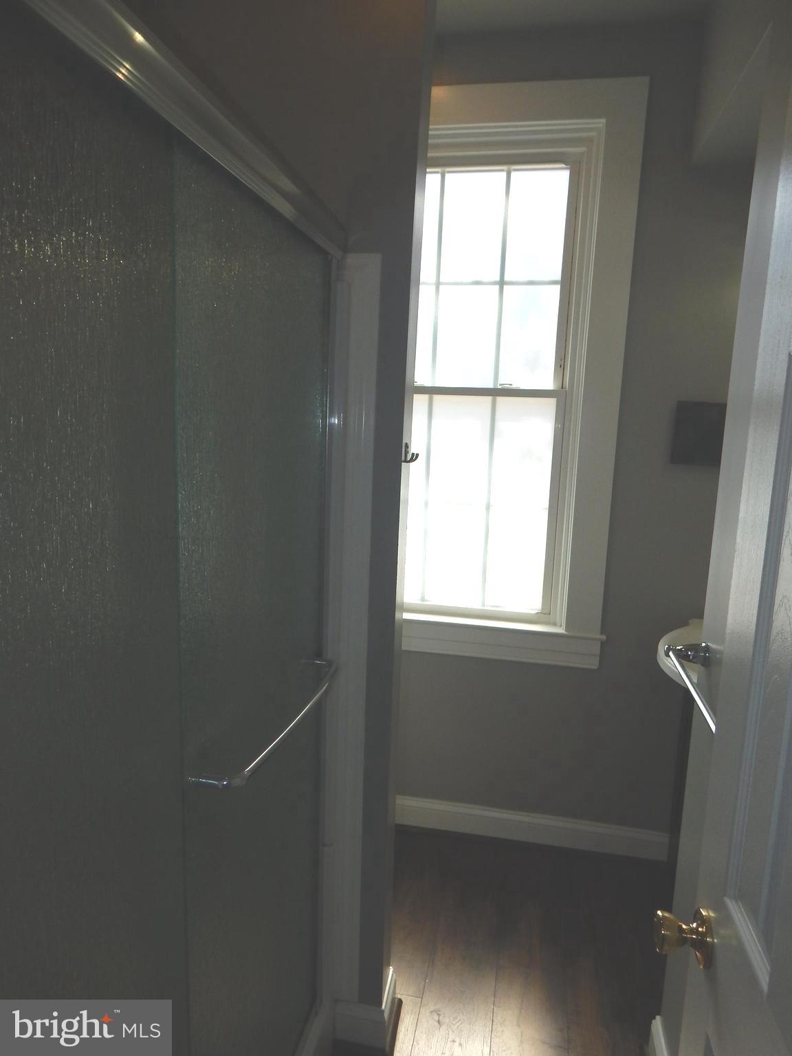 1002 Fawn Street Baltimore, MD 21202 - Photo 16 of 27 a bathroom with a window