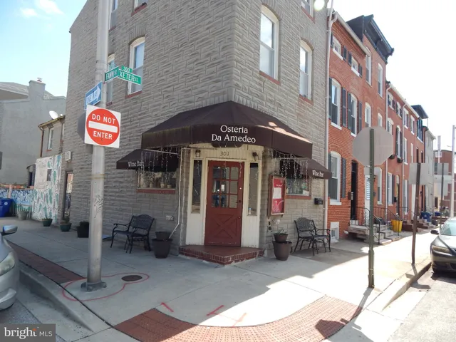 a view of a building with retail shops