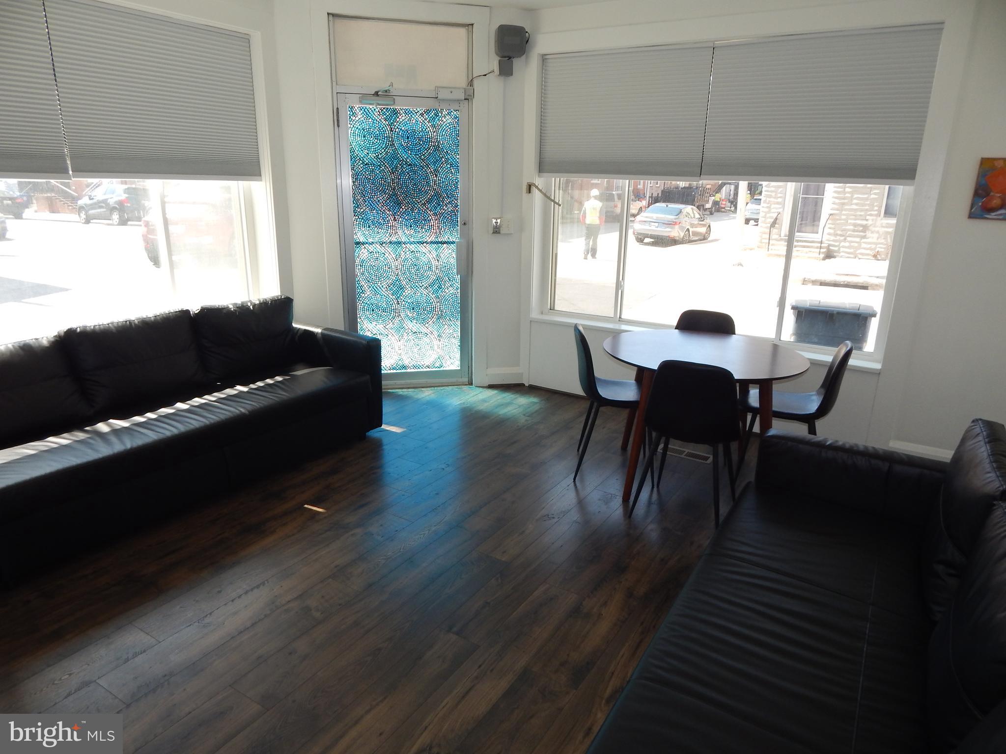 1002 Fawn Street Baltimore, MD 21202 - Photo 9 of 27 a living room with furniture and a large window
