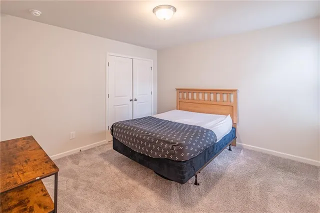 a bedroom with a bed and a cabinets