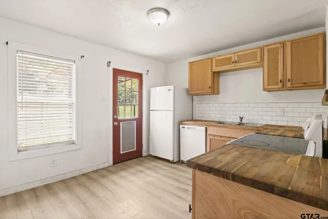 a kitchen that has a sink and a stove