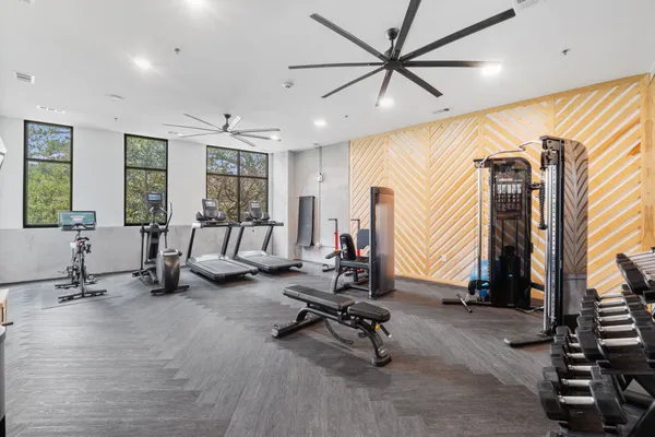 a view of a livingroom with gym equipment