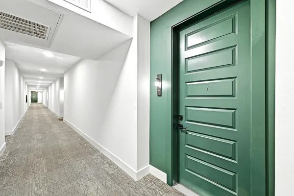 a view of a hallway with a green space