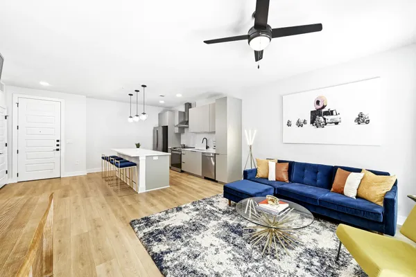 a living room with furniture and a rug