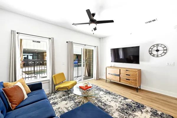 a living room with furniture and a flat screen tv