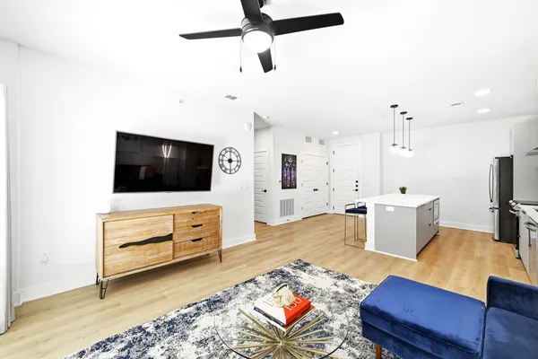 a living room with furniture and a flat screen tv