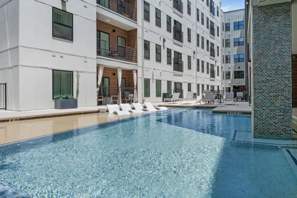 a swimming pool view with a outdoor space