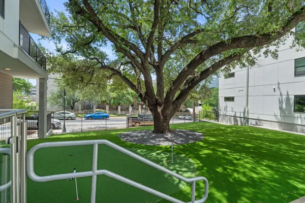 a view of a backyard with sitting area